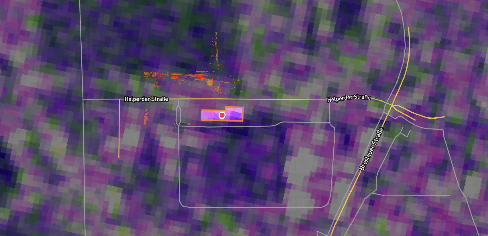 A highlighted parcel over a Sentinel-resolution analysis raster with street and boundary lines